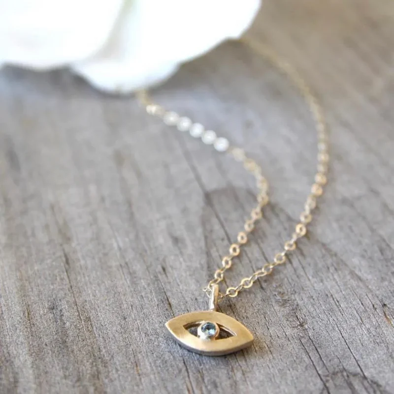 14k gold tiny evil eye necklace emily rosenfeld