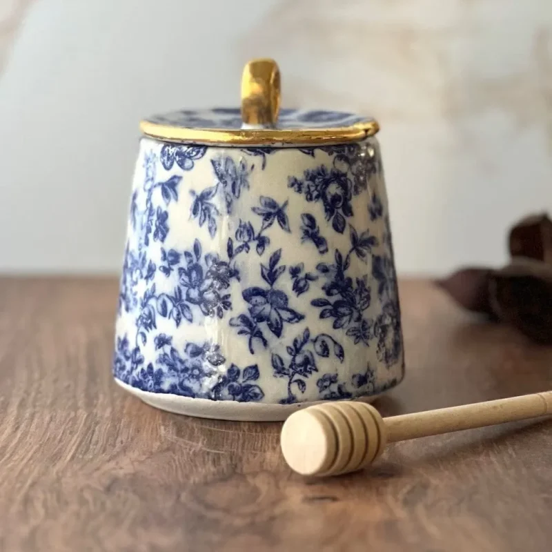 ceramic honey jar with floral design wooden dipper