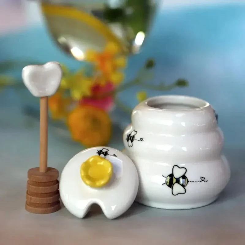 ceramic honey pot with wooden dipper sweet as can bee