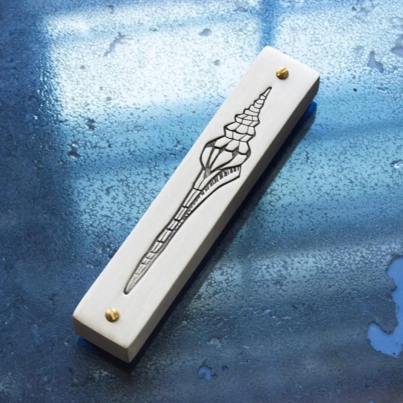 handcrafted emily rosenfeld shell mezuzah