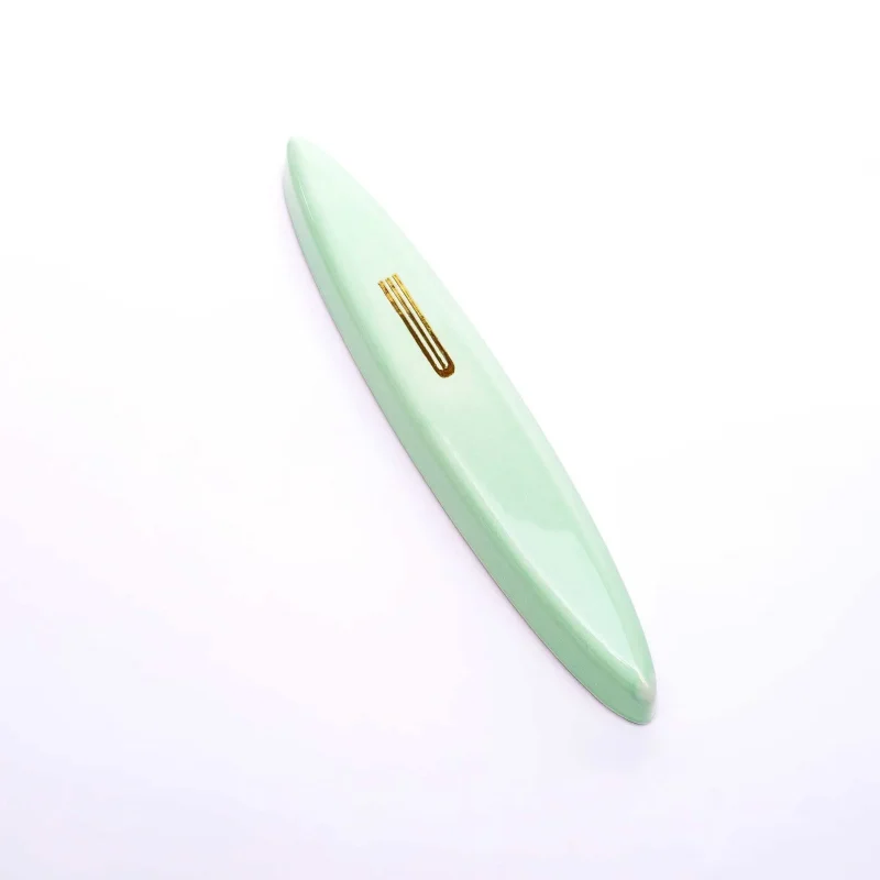 mint green ceramic mezuzah with gold shin by mickala design