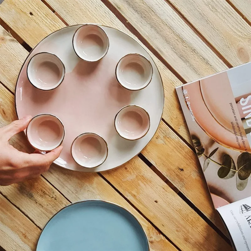 pink white porcelain seder plate by sind studio