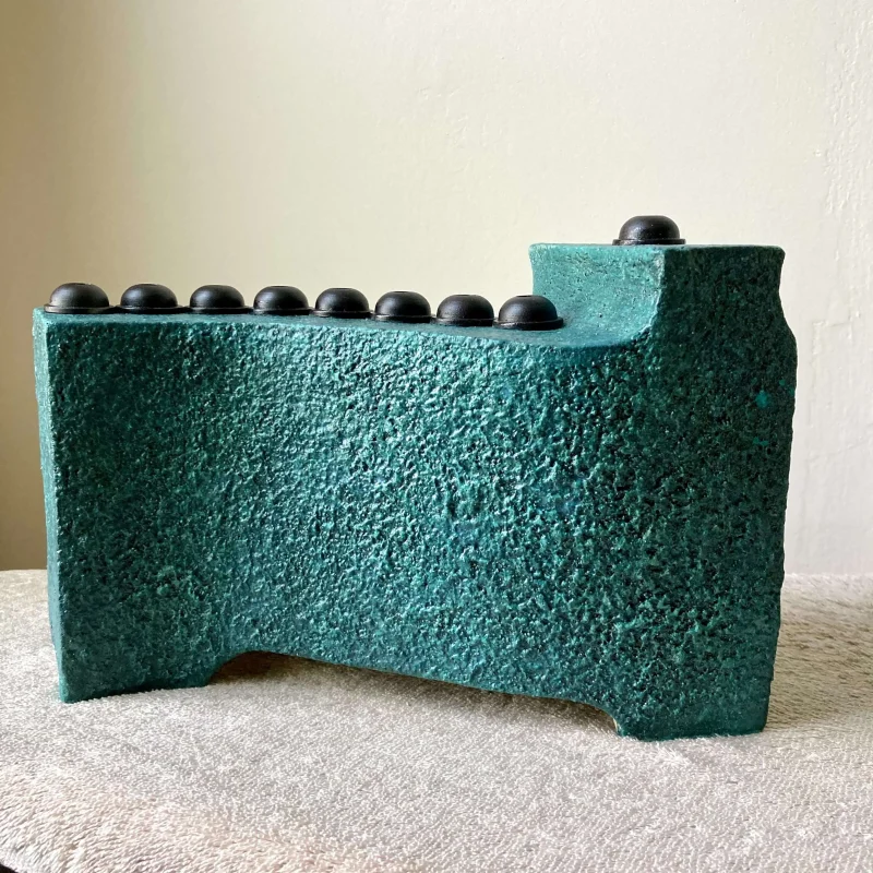 turquoise stoneware ceramic menorah with wrought iron scaled